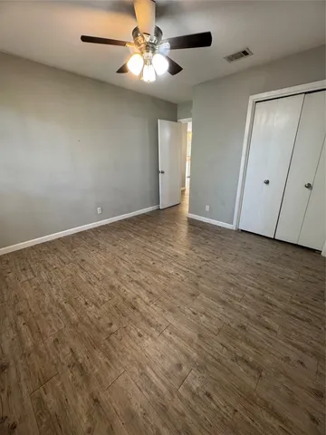 an empty room with fan