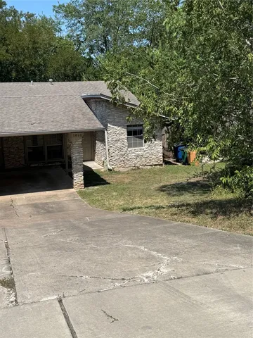 a house with a tree in front of it