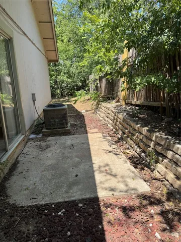 a view of a backyard with trees