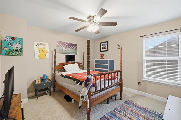 a bed room with furniture and windows