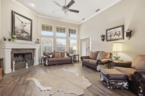 a living room with furniture and a fireplace