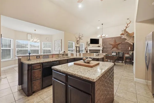 a kitchen with sink and refrigerator