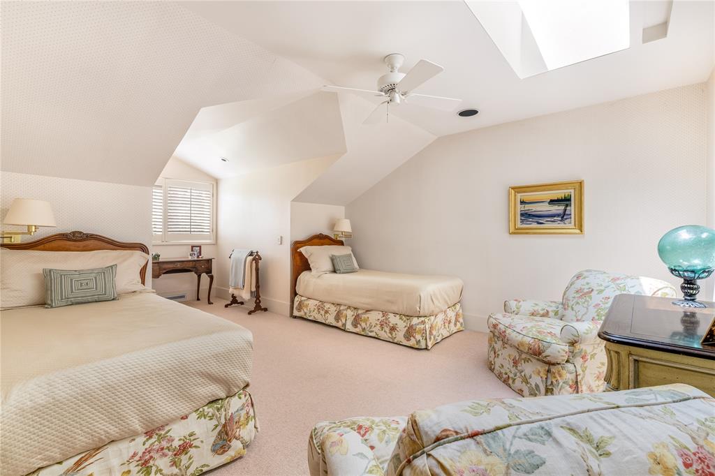 12102 Vendome Place Dallas, TX 75230 - Photo 19 of 24 a spacious bedroom with a bed and window