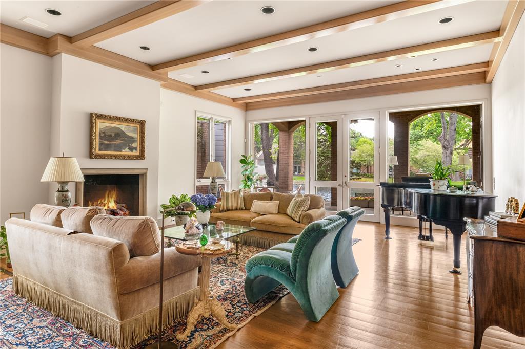 12102 Vendome Place Dallas, TX 75230 - Photo 6 of 24 a living room with fireplace furniture and a large window