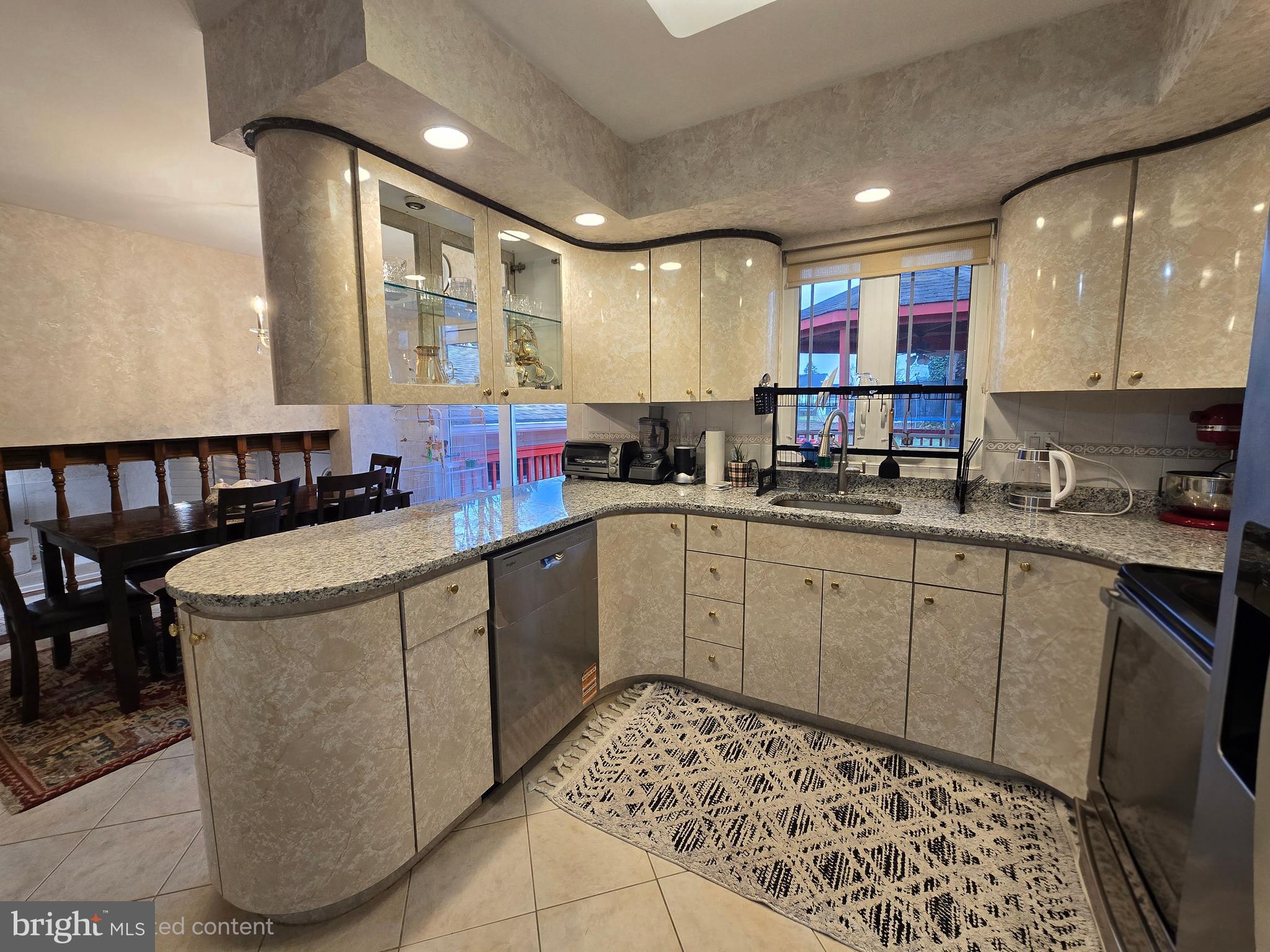 743 Bridgeview Road Feasterville-Trevose, PA 19053 - Photo 12 of 55 a kitchen with a sink appliances cabinets and furniture