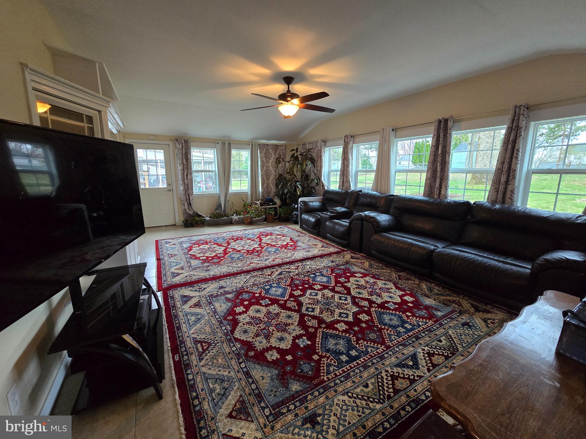 743 Bridgeview Road Feasterville-Trevose, PA 19053 - Photo 18 of 55 a bedroom with a bed a couch and a flat screen tv