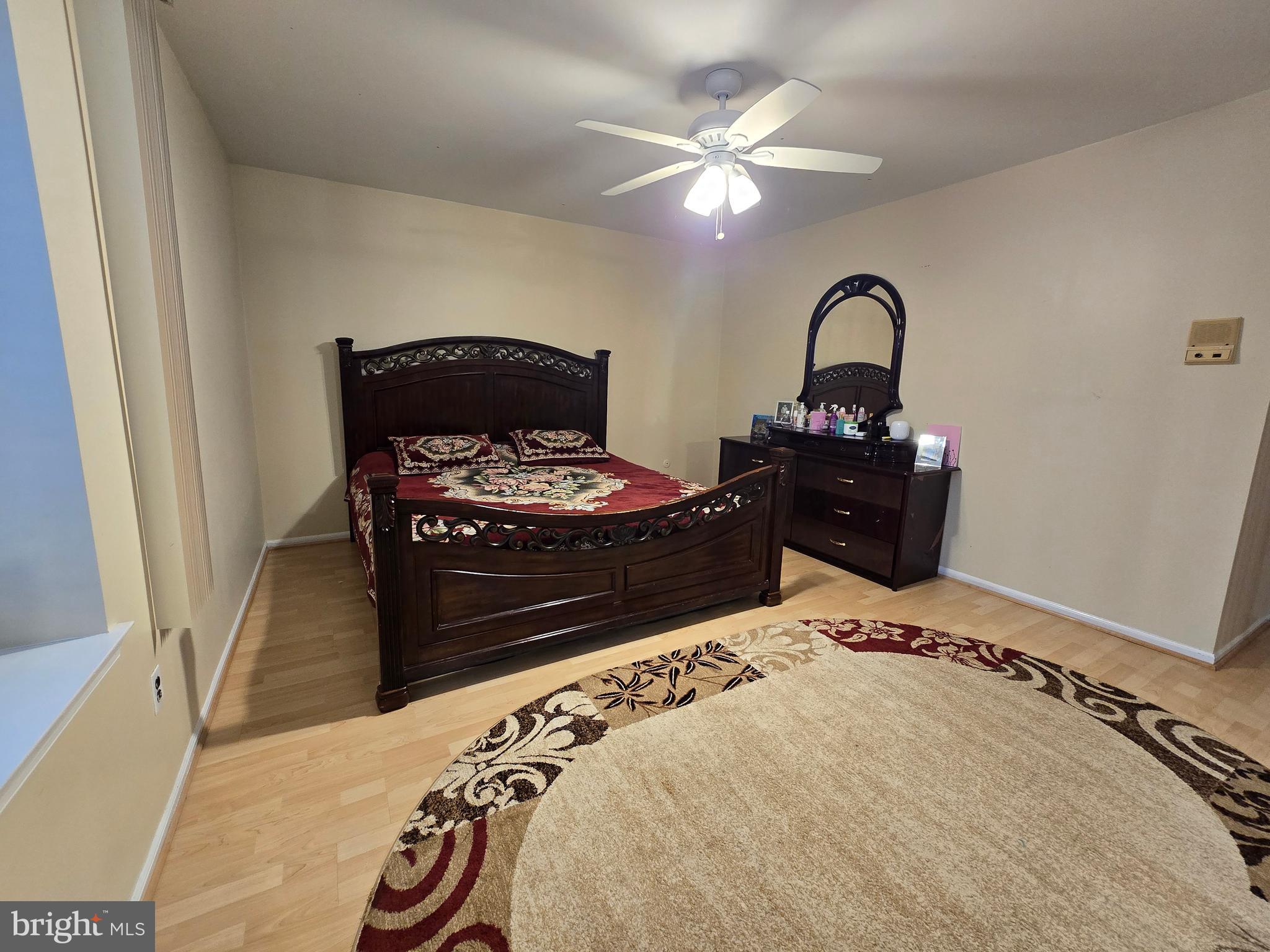 743 Bridgeview Road Feasterville-Trevose, PA 19053 - Photo 27 of 55 a bedroom with a bed and a chandelier