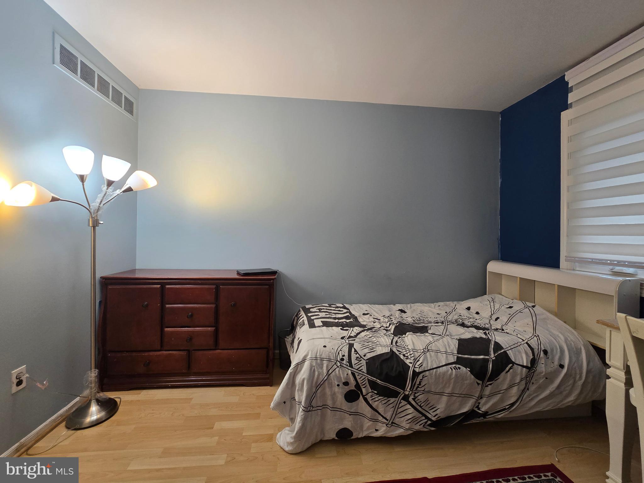 743 Bridgeview Road Feasterville-Trevose, PA 19053 - Photo 39 of 55 a bedroom with a bed and a chandelier
