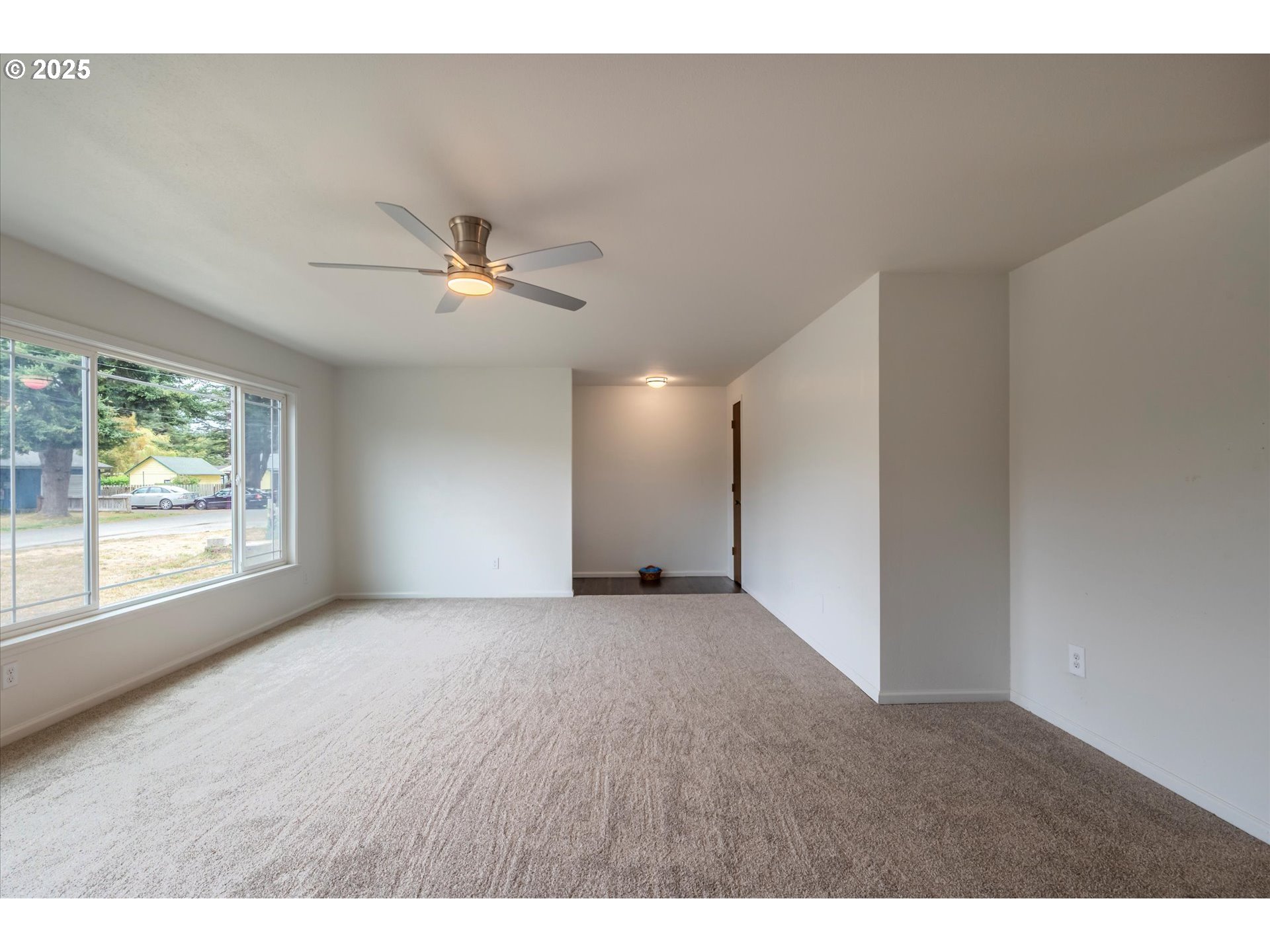 950 1st Street Northeast Bandon, OR 97411 - Photo 16 of 35 a view of an empty room with a window