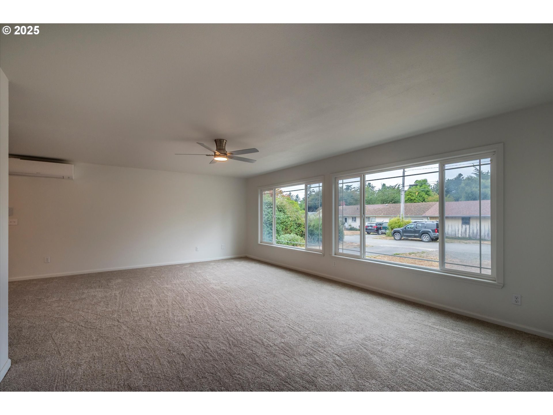950 1st Street Northeast Bandon, OR 97411 - Photo 17 of 35 a view of an empty room with a window