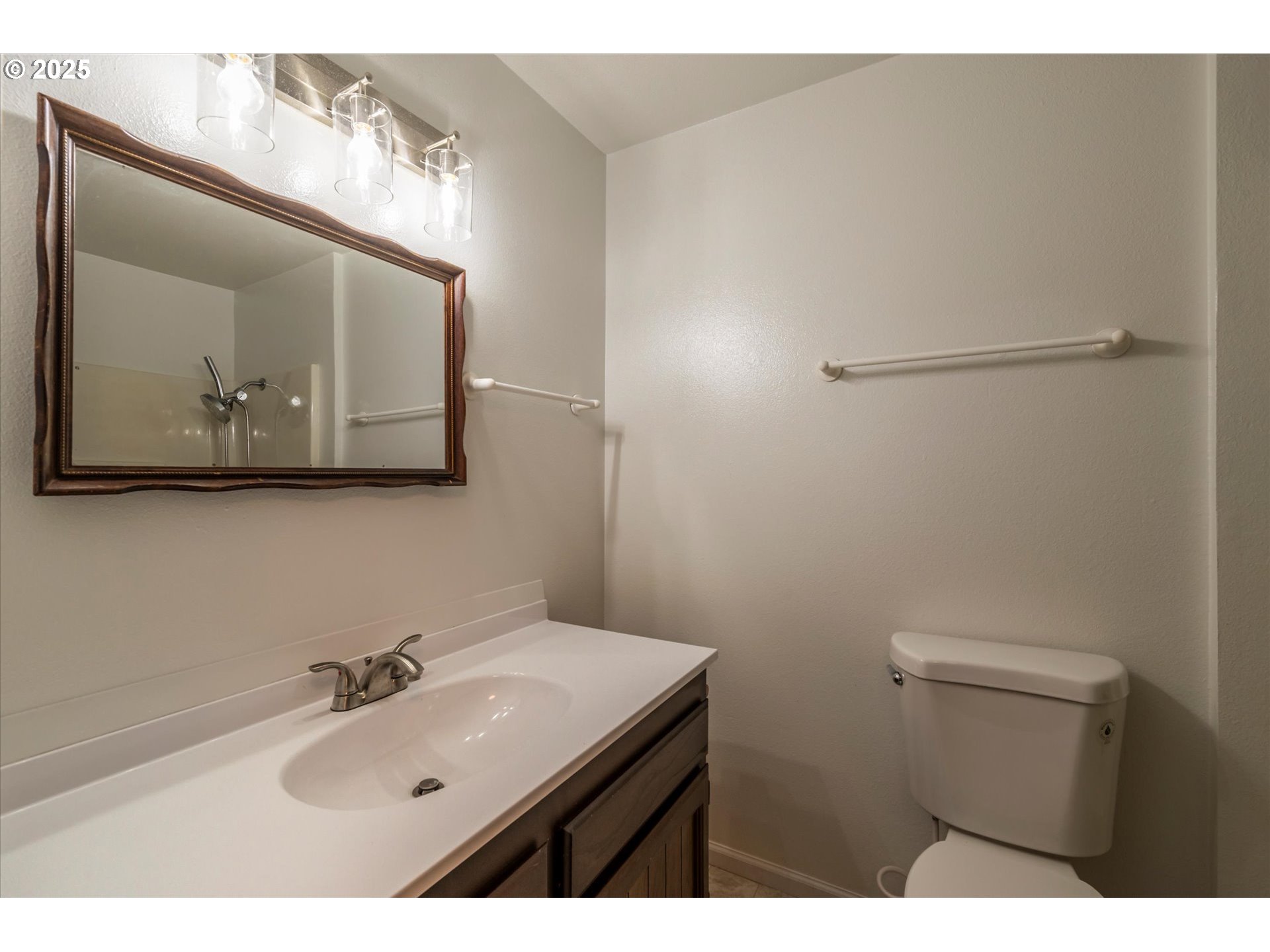950 1st Street Northeast Bandon, OR 97411 - Photo 25 of 35 a bathroom with a sink vanity and toilet