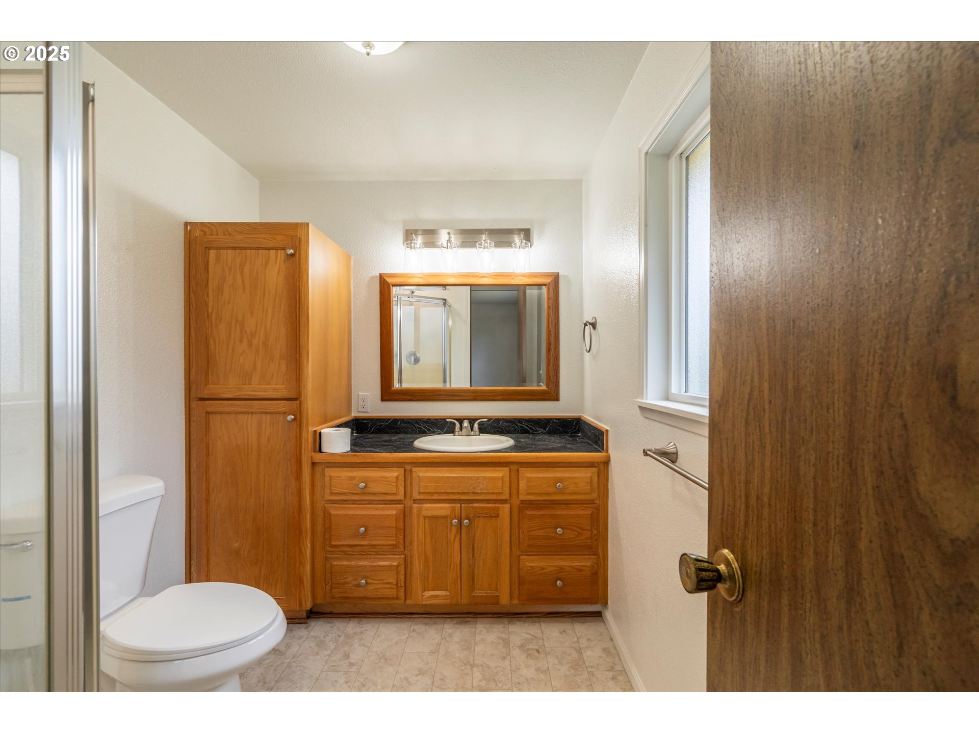 950 1st Street Northeast Bandon, OR 97411 - Photo 28 of 35 a bathroom with a sink a toilet and mirror