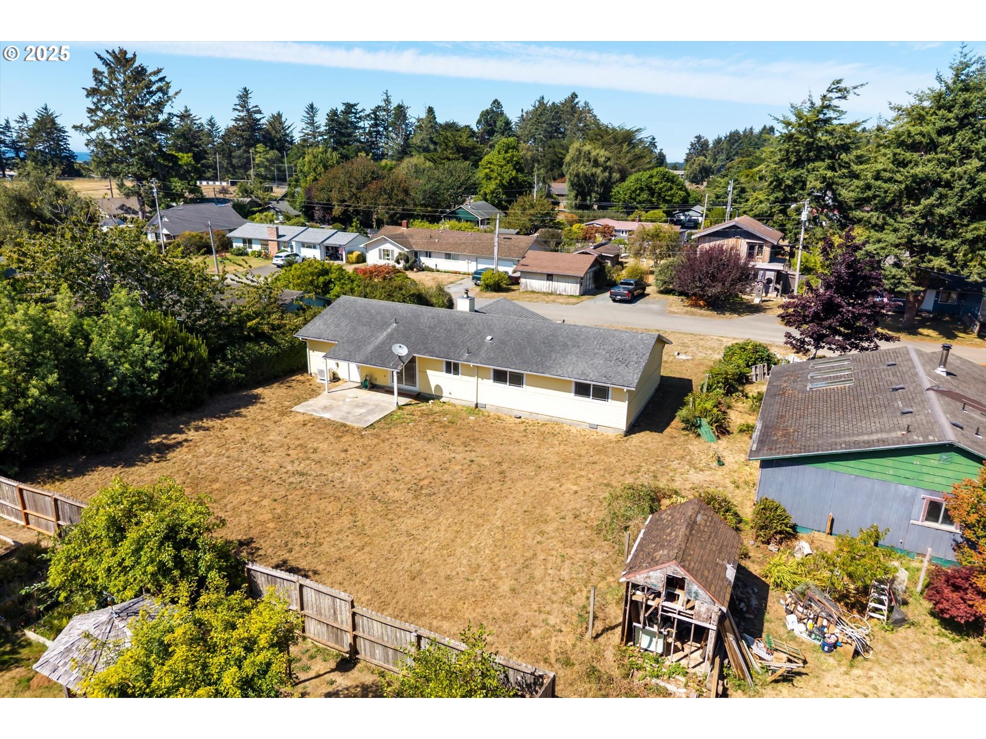 950 1st Street Northeast Bandon, OR 97411 - Photo 3 of 35 a view of a house with a outdoor space
