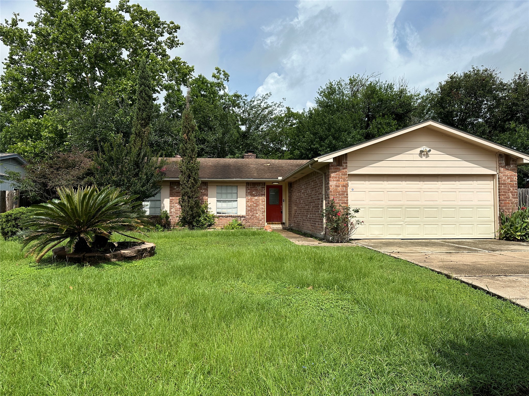 8511 Little River Road Houston, TX 77064 - Photo 2 of 19 a front view of a house with a yard