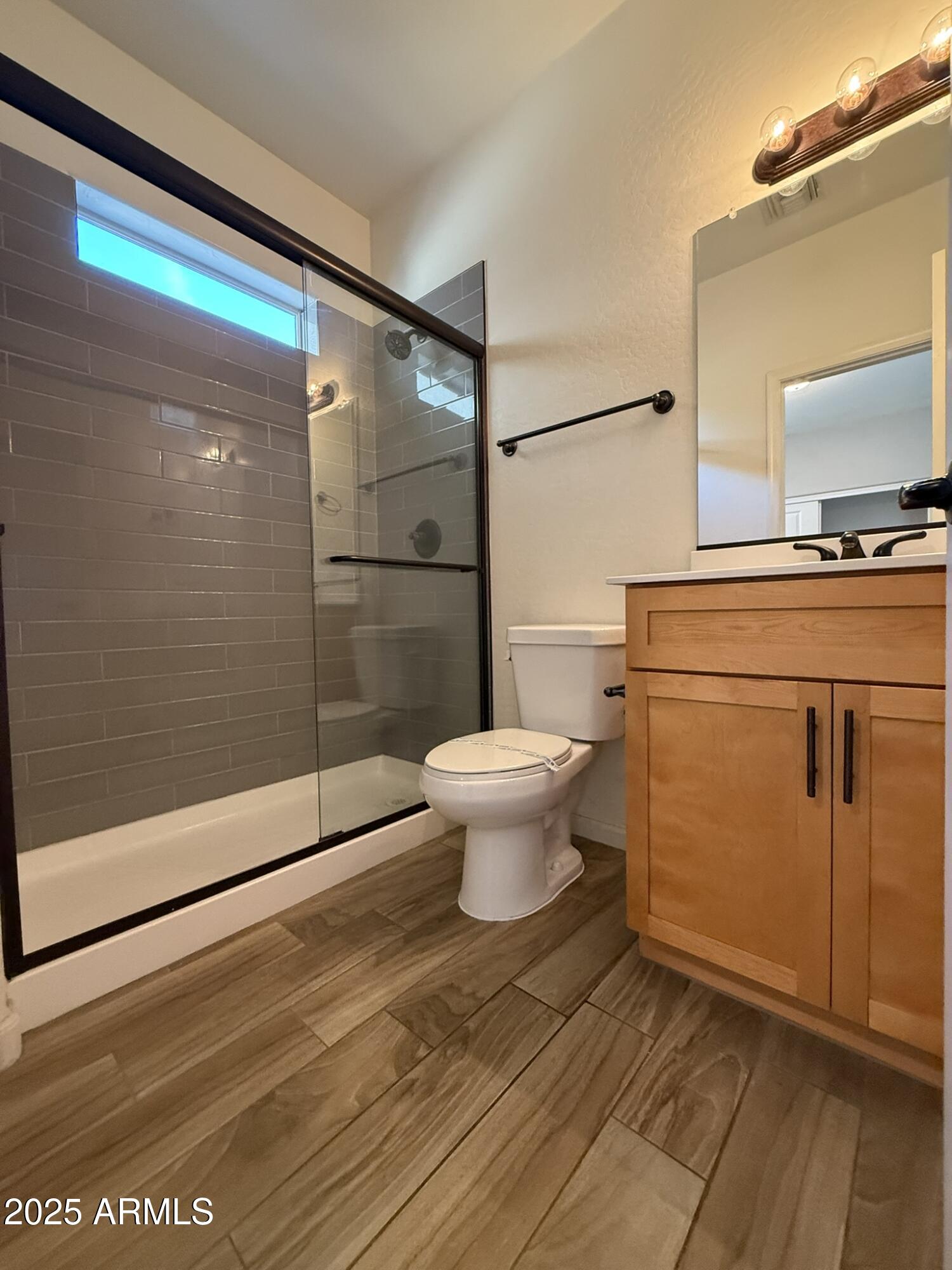 1736 West Pollack Street Phoenix, AZ 85041 - Photo 18 of 51 a bathroom with a toilet and a shower