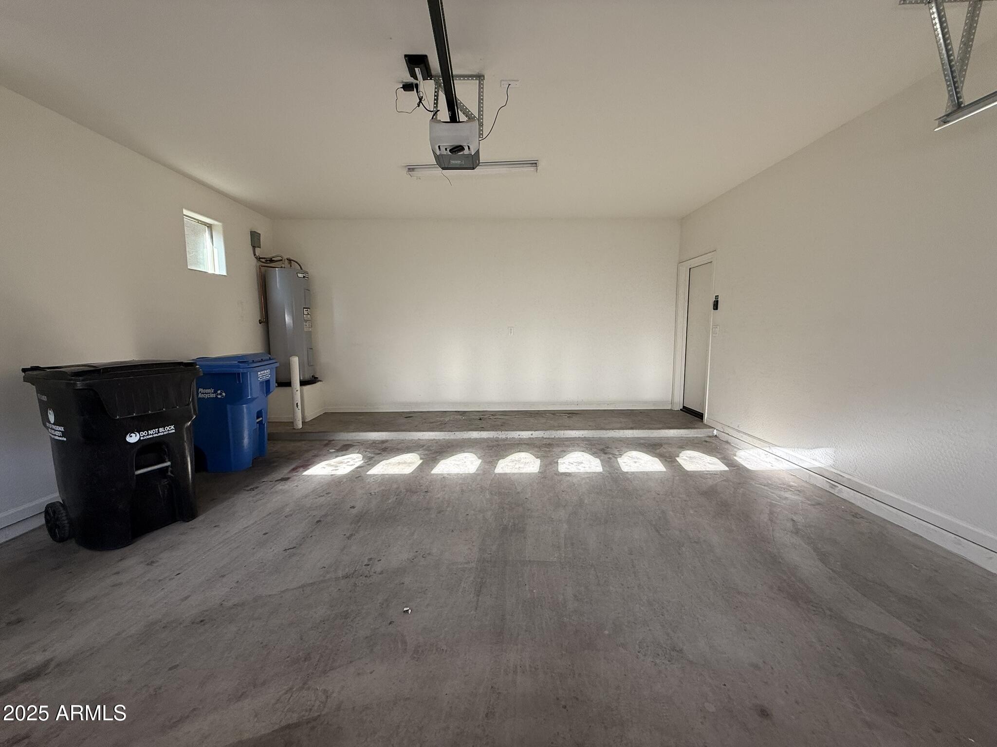 1736 West Pollack Street Phoenix, AZ 85041 - Photo 23 of 51 a view of an empty room with window and hardwood floor