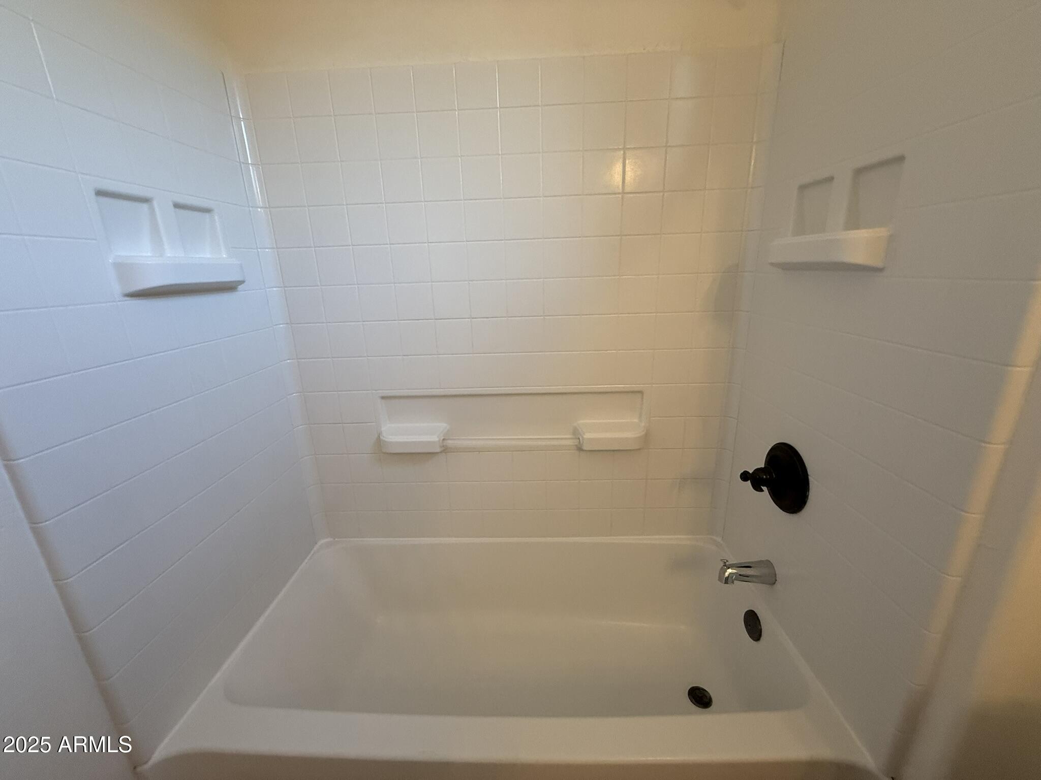 1736 West Pollack Street Phoenix, AZ 85041 - Photo 30 of 51 a close up of a bathtub