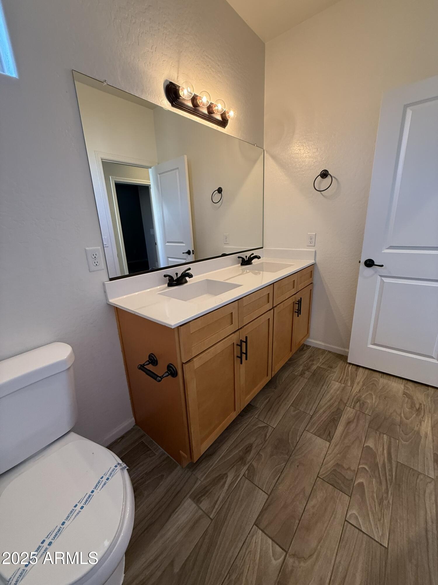 1736 West Pollack Street Phoenix, AZ 85041 - Photo 31 of 51 a spacious bathroom with a sink and mirror