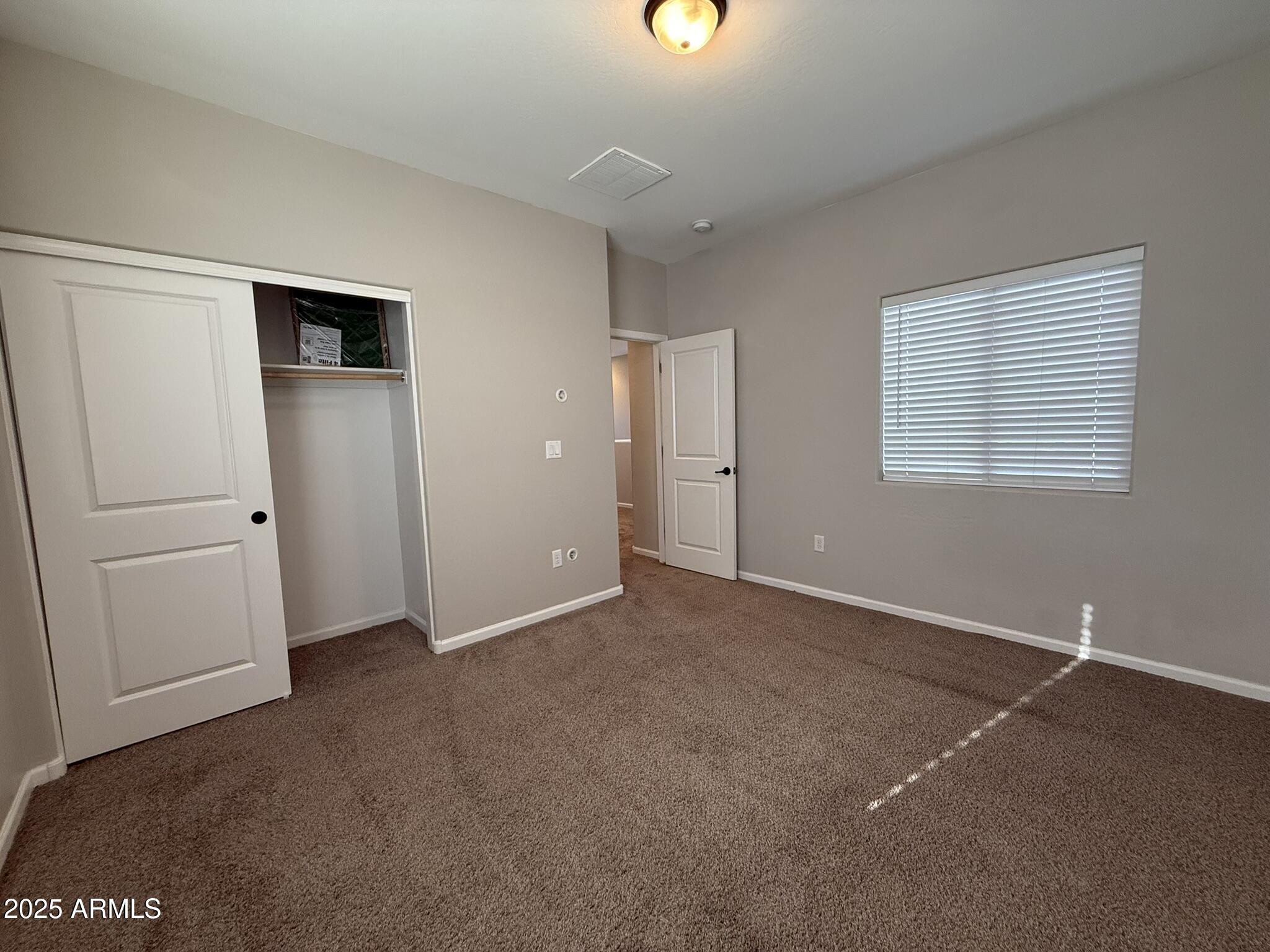 1736 West Pollack Street Phoenix, AZ 85041 - Photo 35 of 51 a view of an empty room with a window