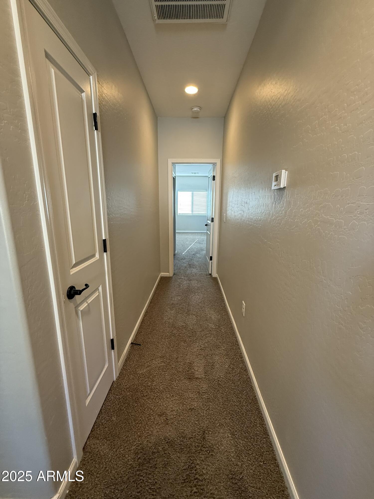 1736 West Pollack Street Phoenix, AZ 85041 - Photo 36 of 51 a view of a hallway with wooden floor and a bathroom