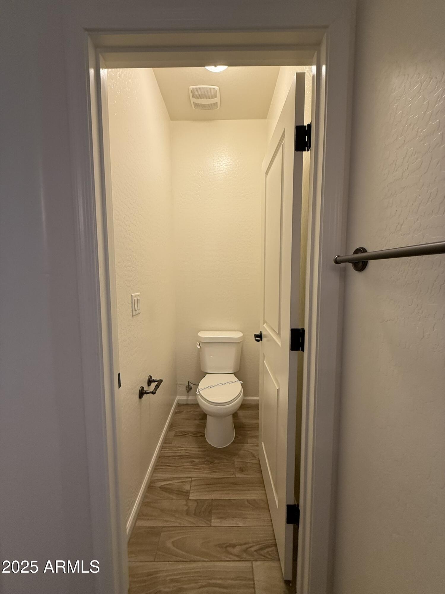 1736 West Pollack Street Phoenix, AZ 85041 - Photo 42 of 51 a bathroom with a granite countertop toilet a sink and a mirror