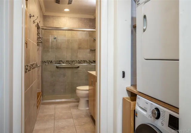 a bathroom with a shower a toilet and a shower