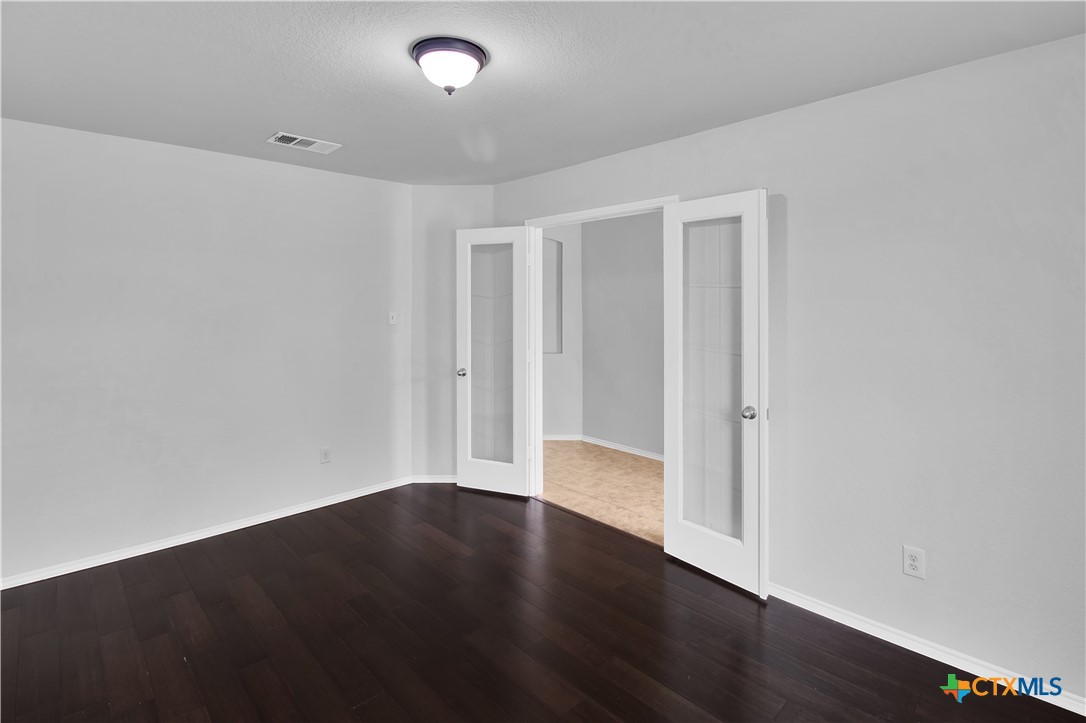 117 Bashaw Loop Temple, TX 76502 - Photo 6 of 20 an empty room with wooden floor