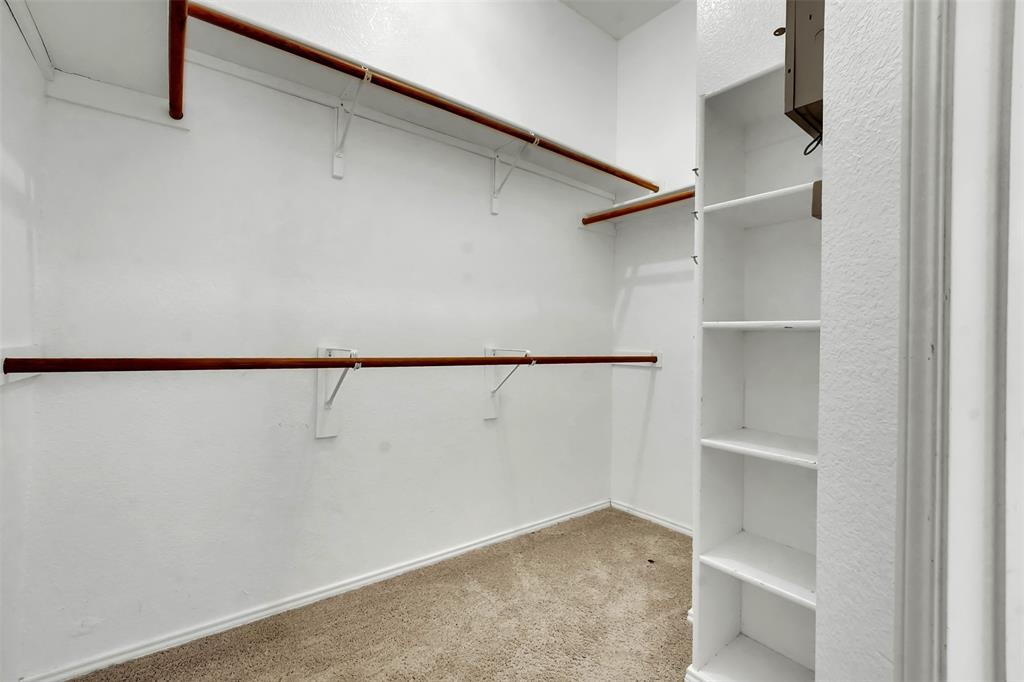 4507 Stones River Road Grand Prairie, TX 75052 - Photo 26 of 28 a view of an empty walk in closet