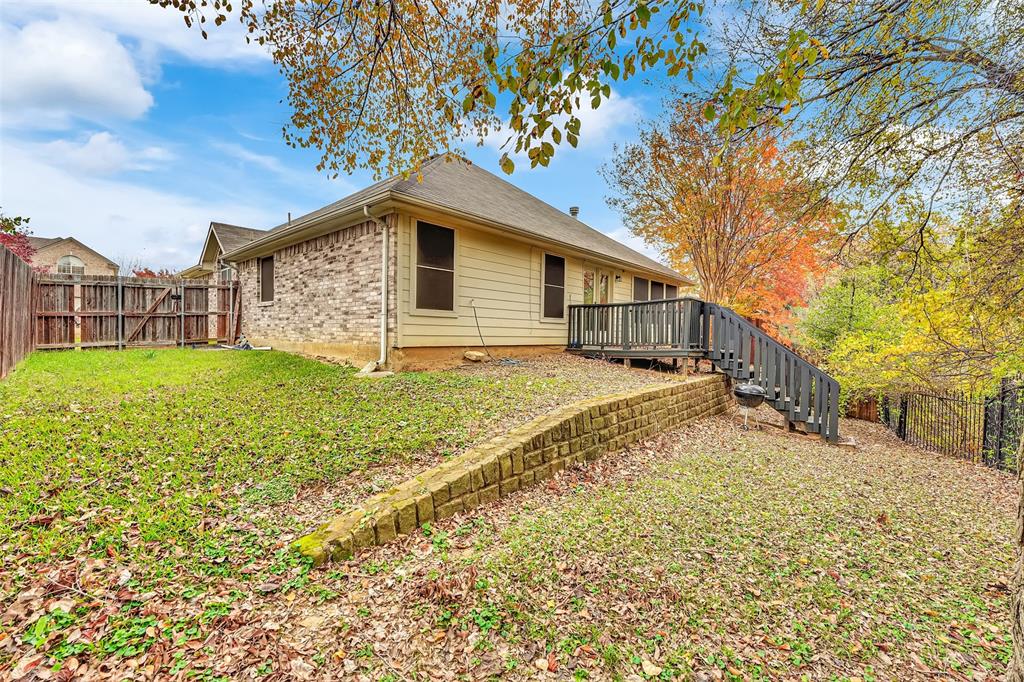 4507 Stones River Road Grand Prairie, TX 75052 - Photo 28 of 28 a backyard of a house with wooden fence