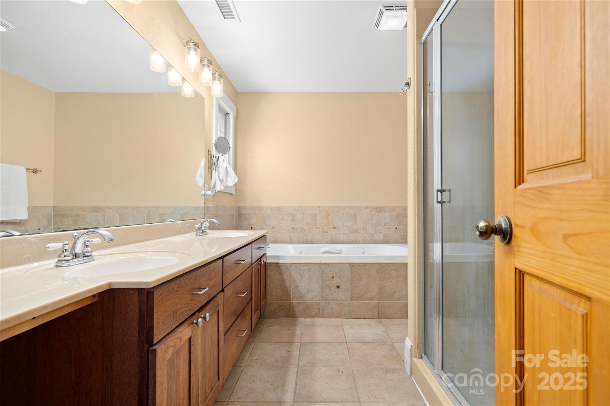 571 Terrys Gap Road Fletcher, NC 28732 - Photo 30 of 44 a bathroom with a granite countertop sink and a mirror