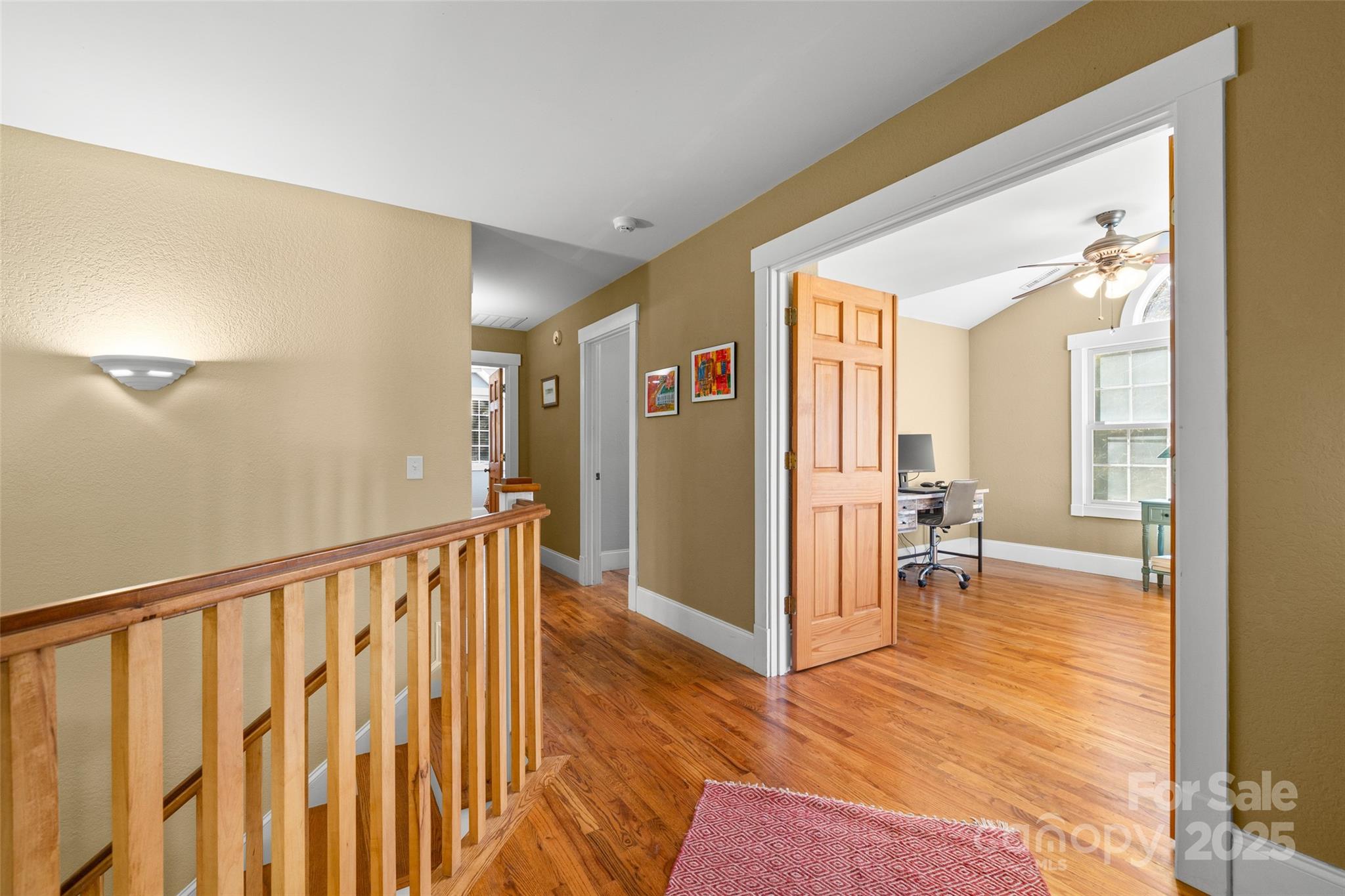571 Terrys Gap Road Fletcher, NC 28732 - Photo 32 of 44 a view of a hallway with wooden floor and furniture