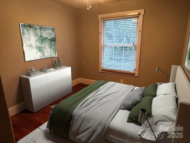 a view of a livingroom with workspace and a window