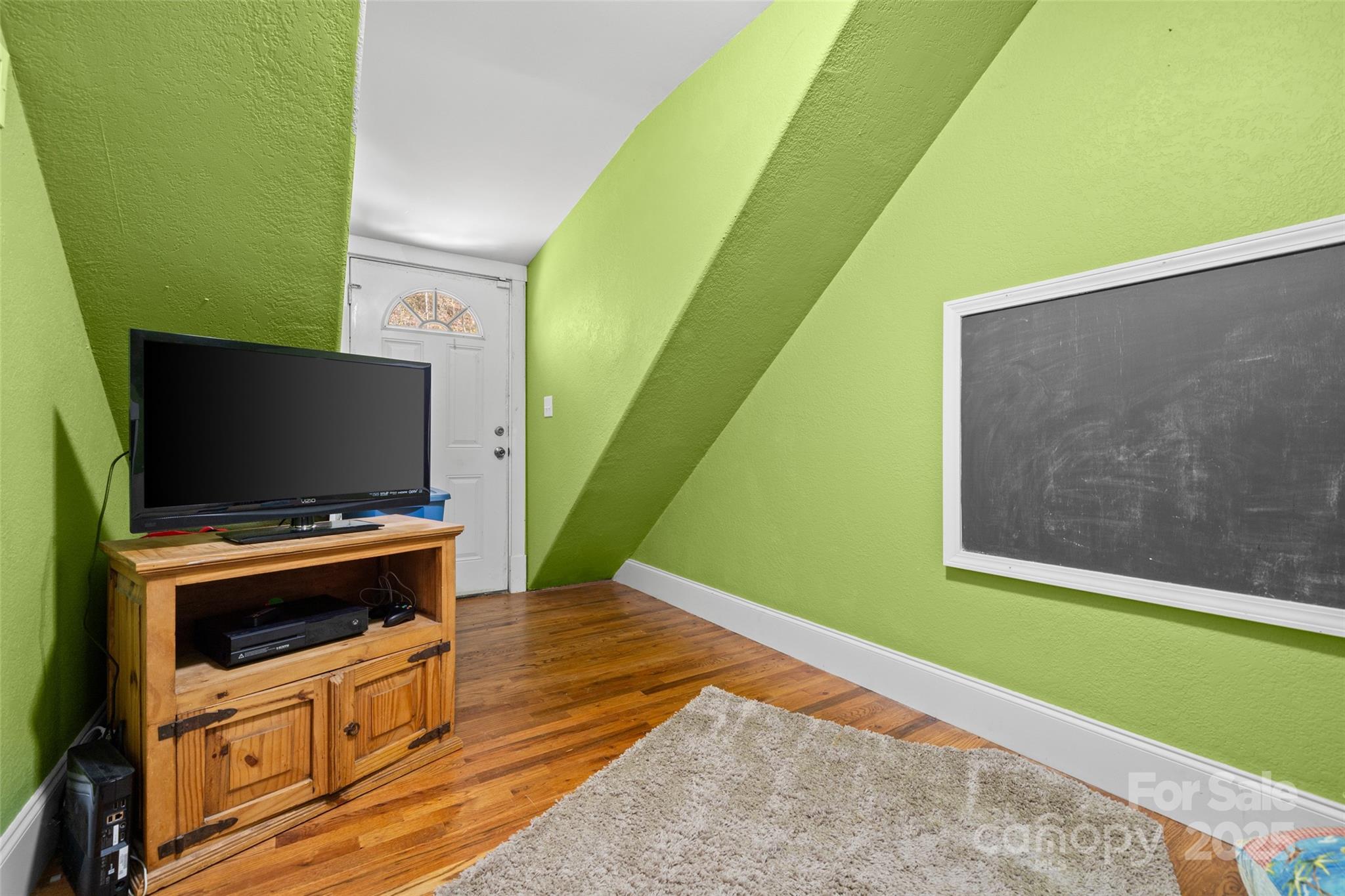 571 Terrys Gap Road Fletcher, NC 28732 - Photo 39 of 44 a living room with furniture and a flat screen tv