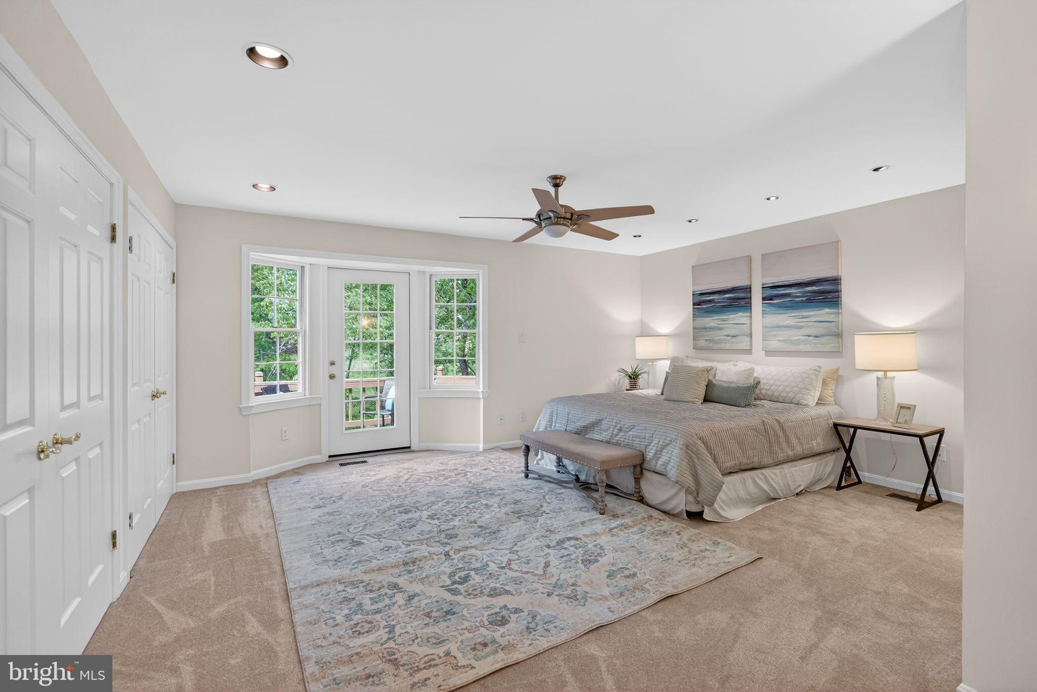 13821 Esworthy Road Darnestown, MD 20874 - Photo 13 of 98 a spacious bedroom with a bed and window