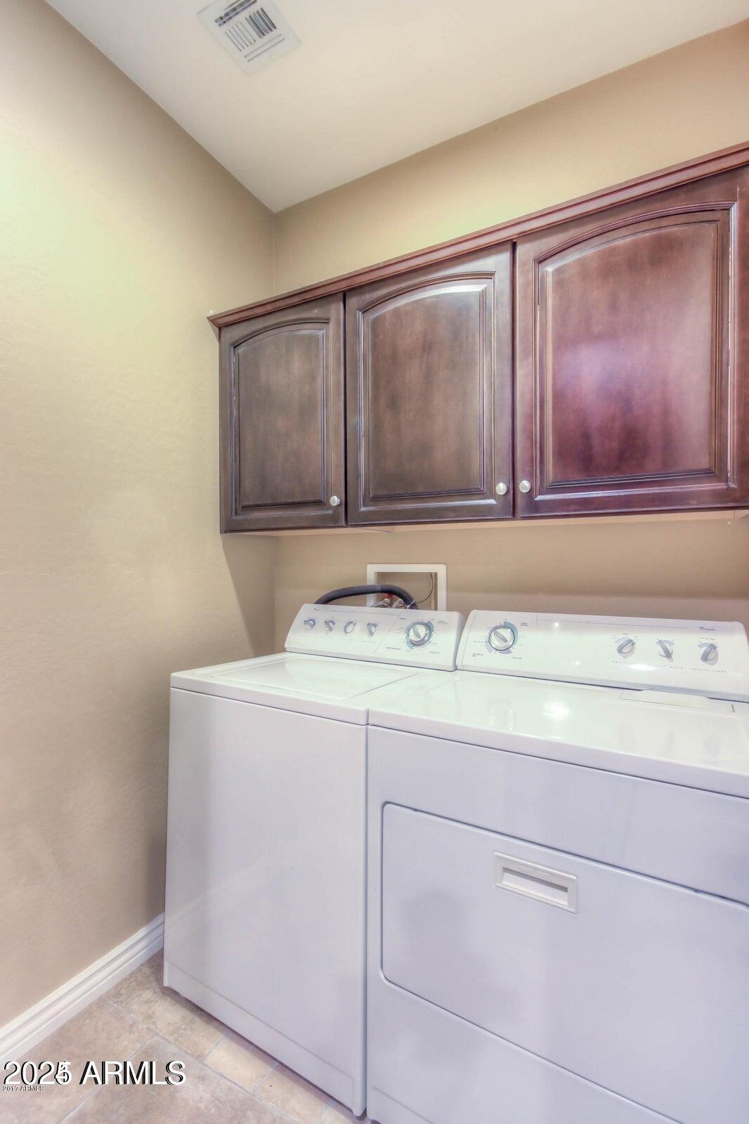 2482 East Roma Avenue Phoenix, AZ 85016 - Photo 11 of 39 a utility room with washer and dryer