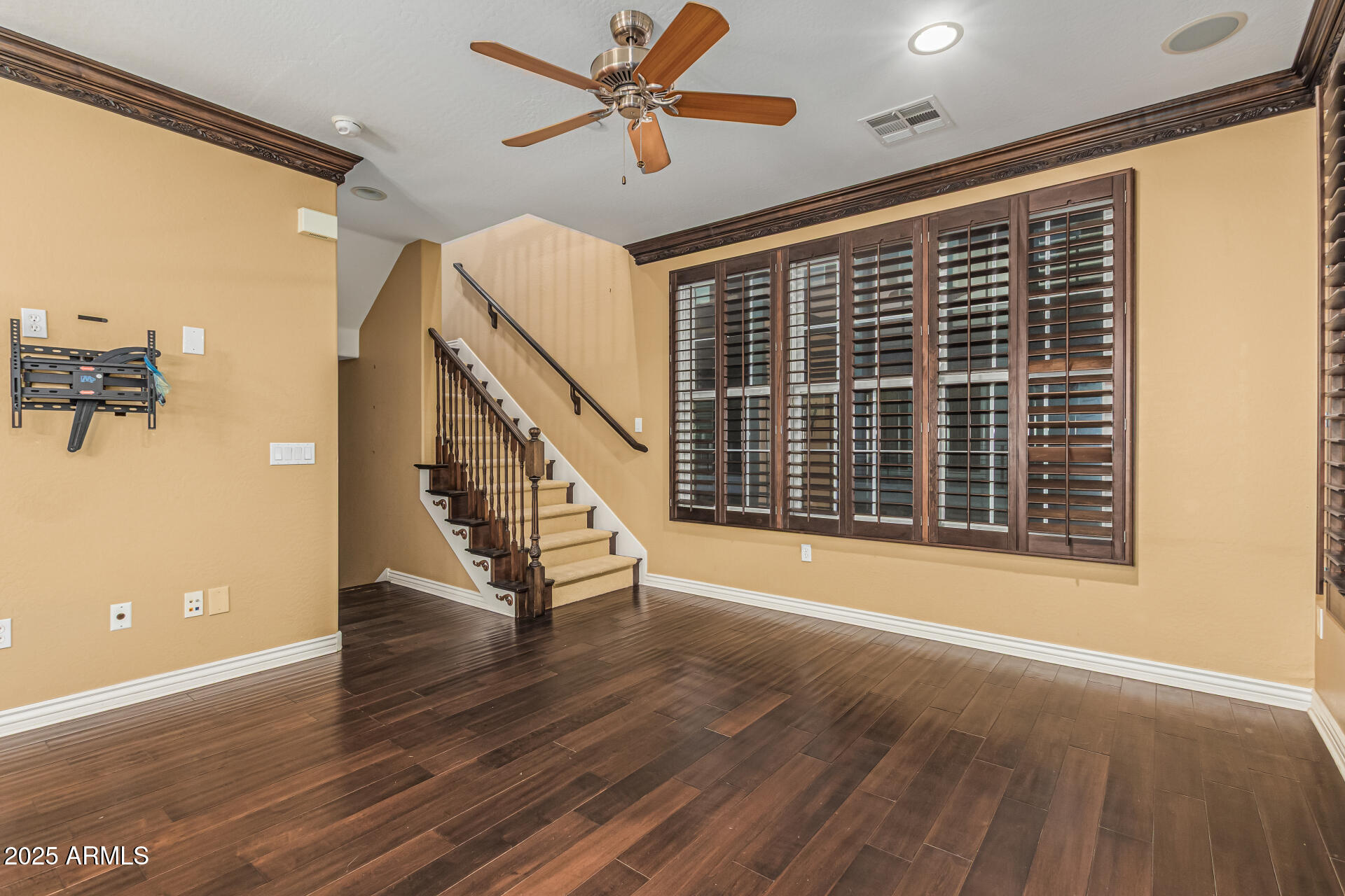 2482 East Roma Avenue Phoenix, AZ 85016 - Photo 13 of 39 a view of an empty room with wooden floor and a window