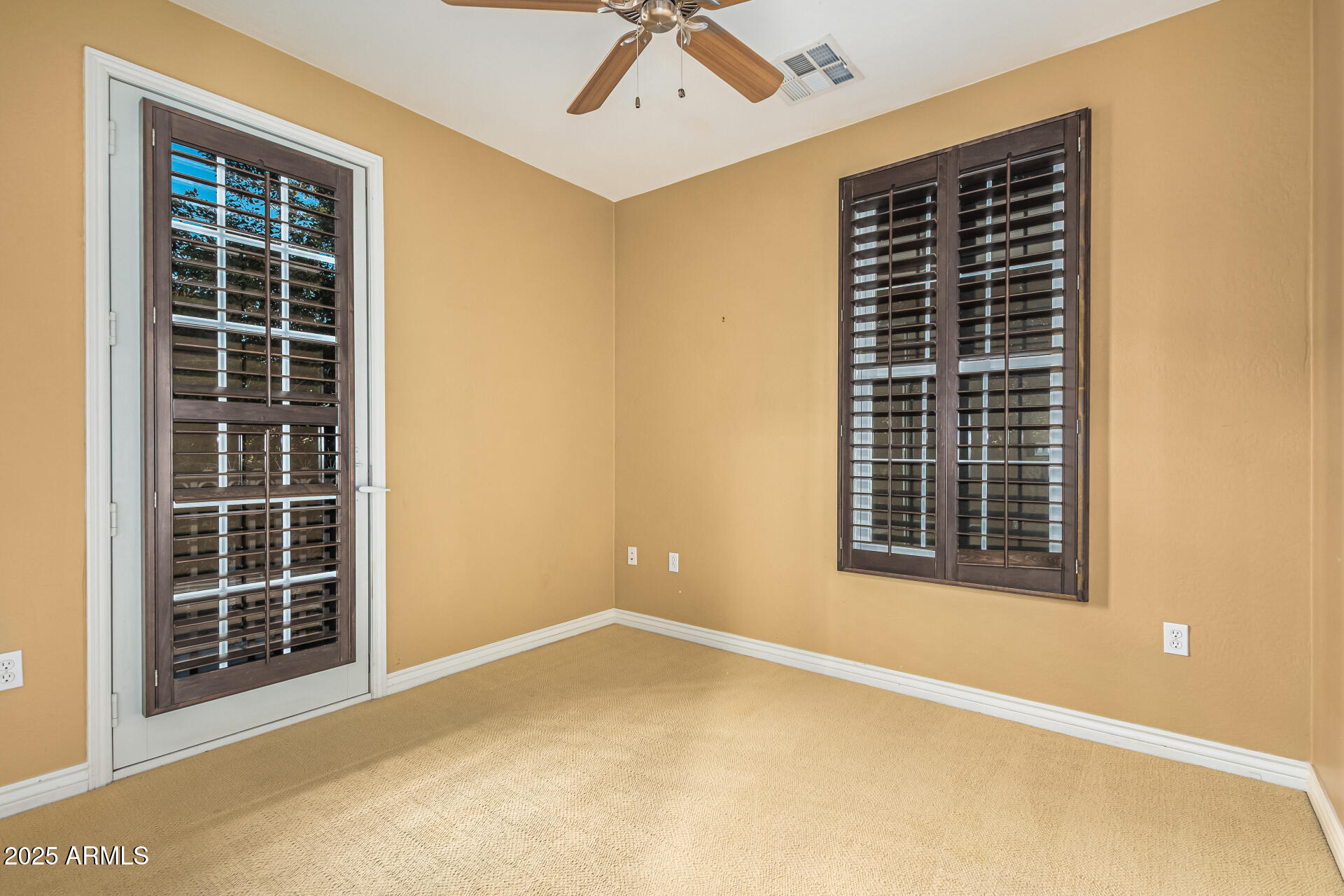 2482 East Roma Avenue Phoenix, AZ 85016 - Photo 14 of 39 an empty room with windows