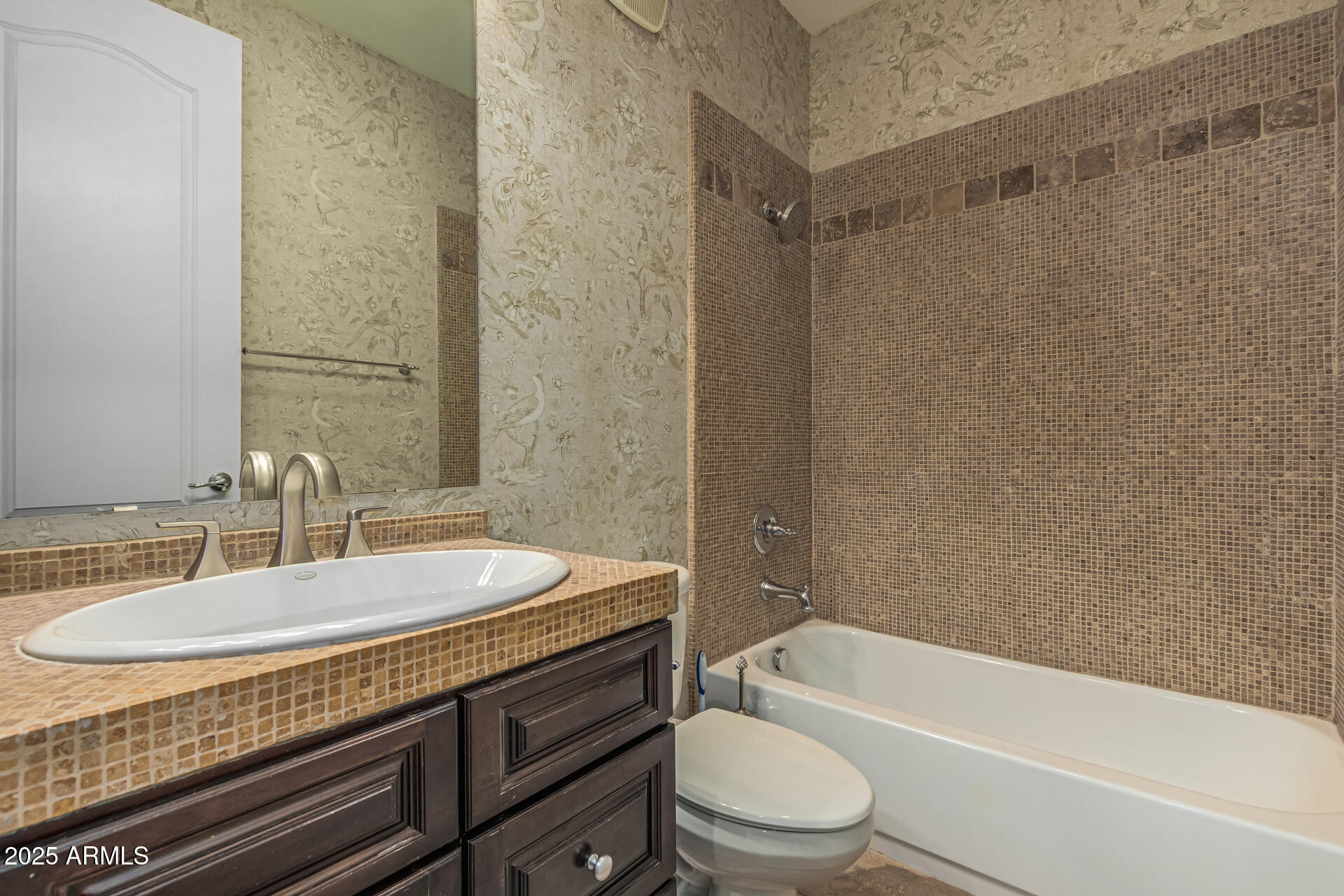 2482 East Roma Avenue Phoenix, AZ 85016 - Photo 15 of 39 a bathroom with a granite countertop bathtub shower sink vanity mirror and toilet