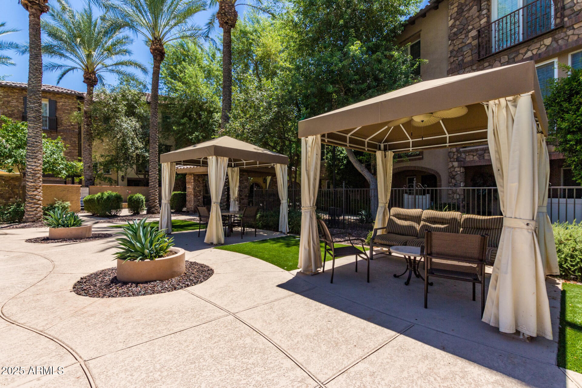 2482 East Roma Avenue Phoenix, AZ 85016 - Photo 25 of 39 a view of a chair and table in backyard of the house