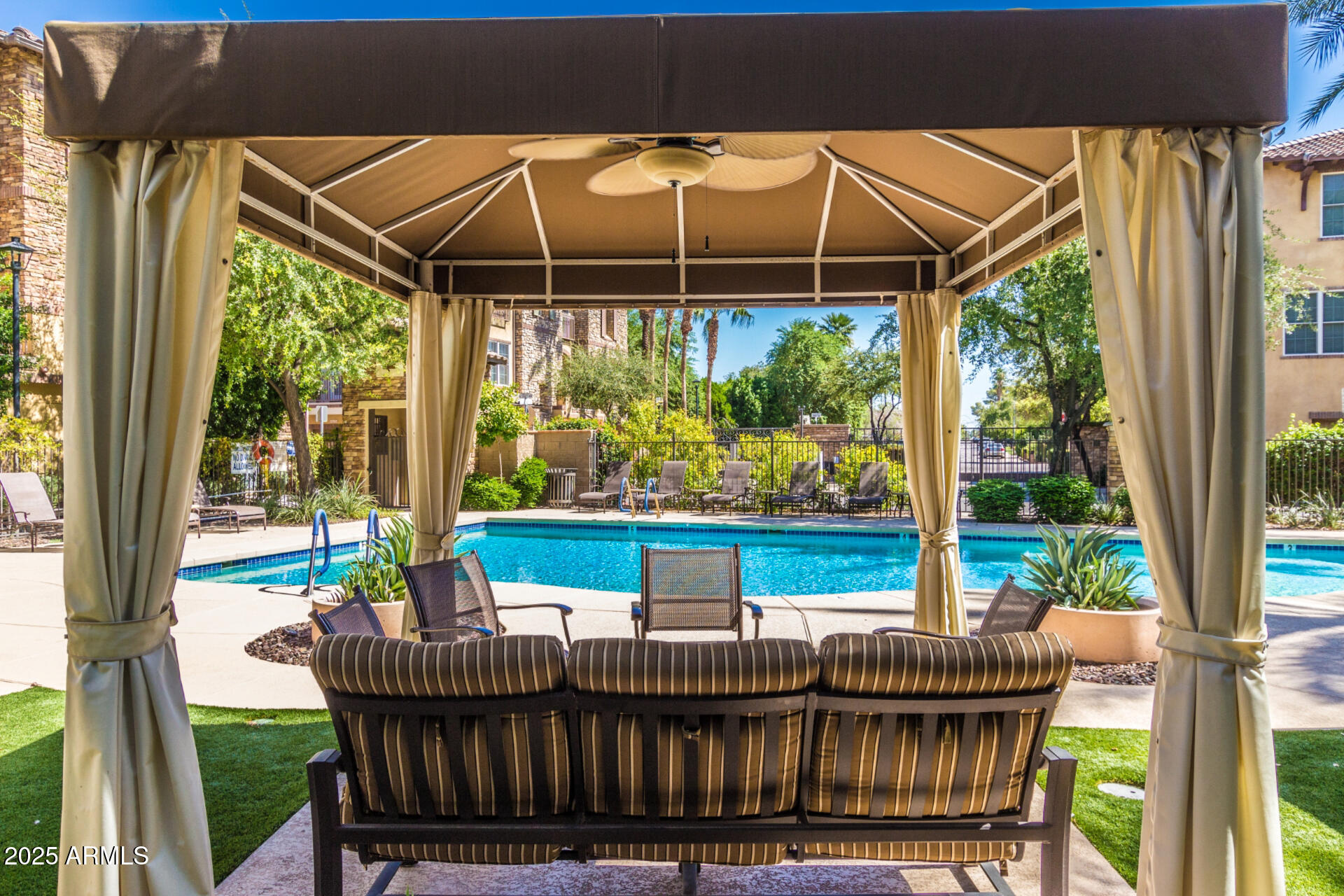 2482 East Roma Avenue Phoenix, AZ 85016 - Photo 27 of 39 a patio with a table a table and chairs