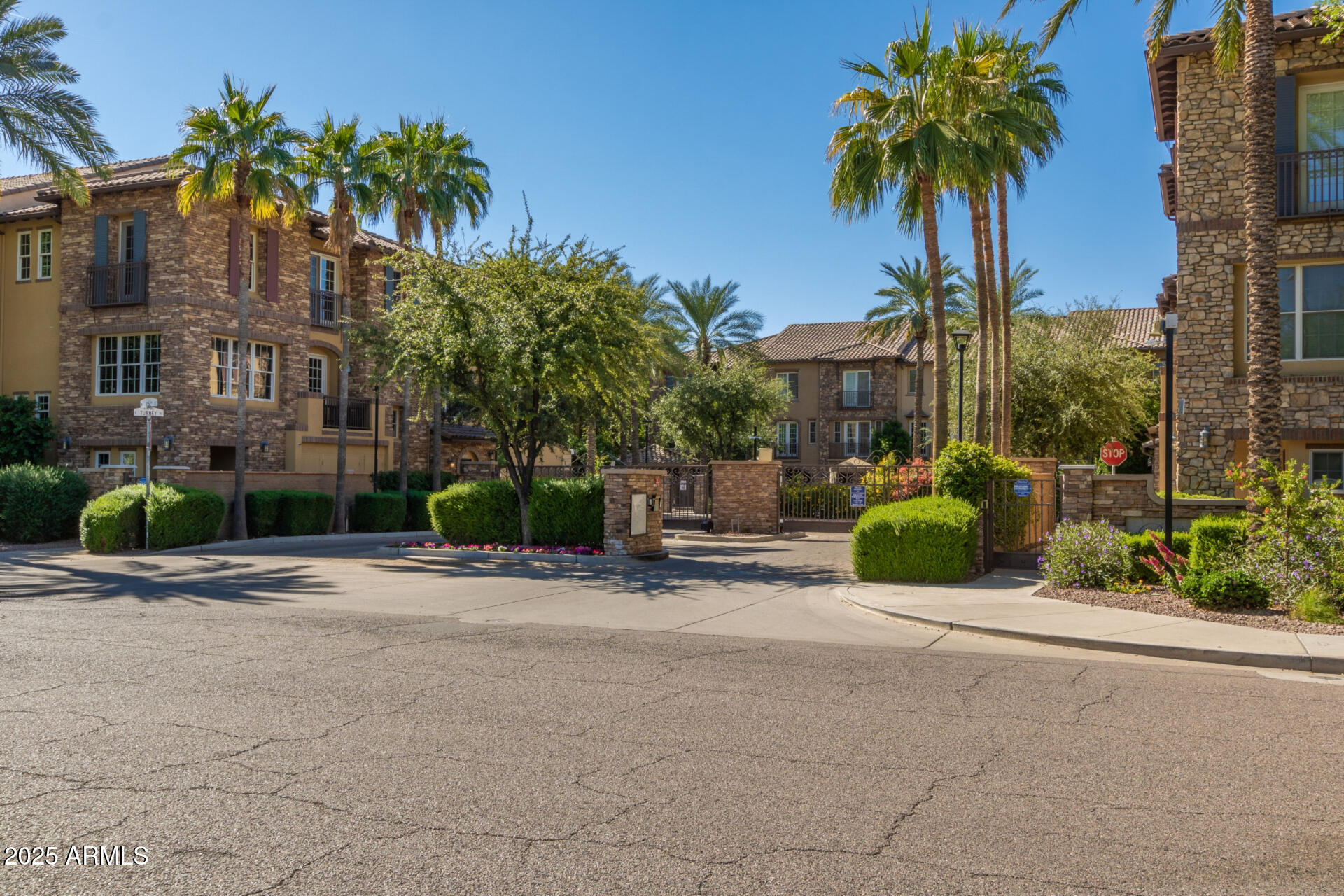 2482 East Roma Avenue Phoenix, AZ 85016 - Photo 33 of 39 a view of a street with a building and palm trees
