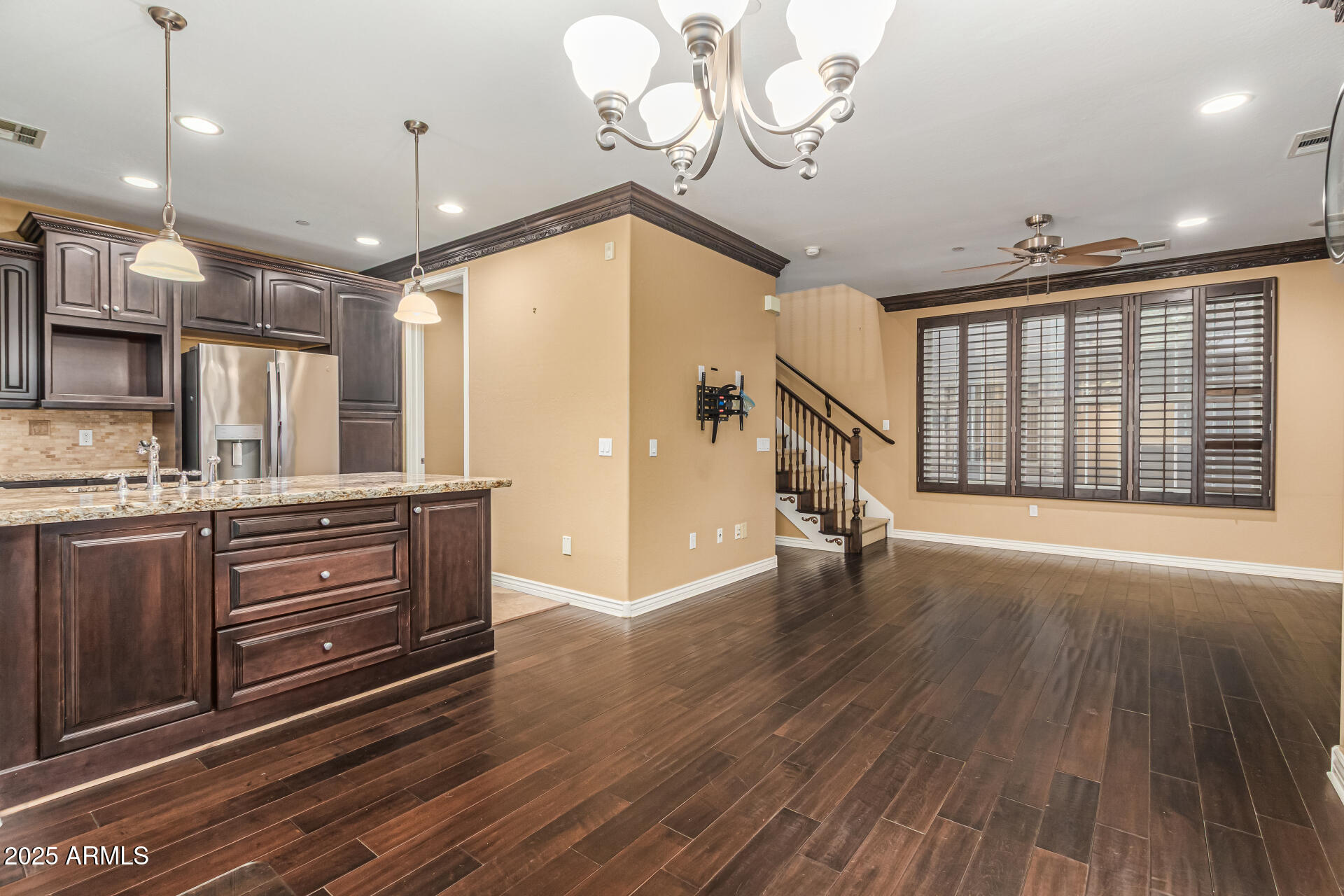 2482 East Roma Avenue Phoenix, AZ 85016 - Photo 6 of 39 a view of an empty room with wooden floor and a window