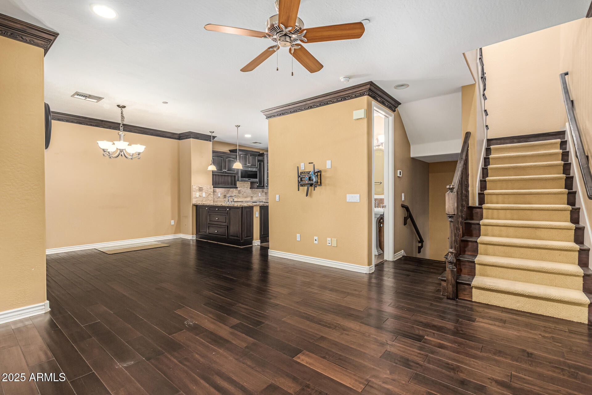 2482 East Roma Avenue Phoenix, AZ 85016 - Photo 10 of 39 a view of a kitchen with a refrigerator a ceiling fan and wooden floor