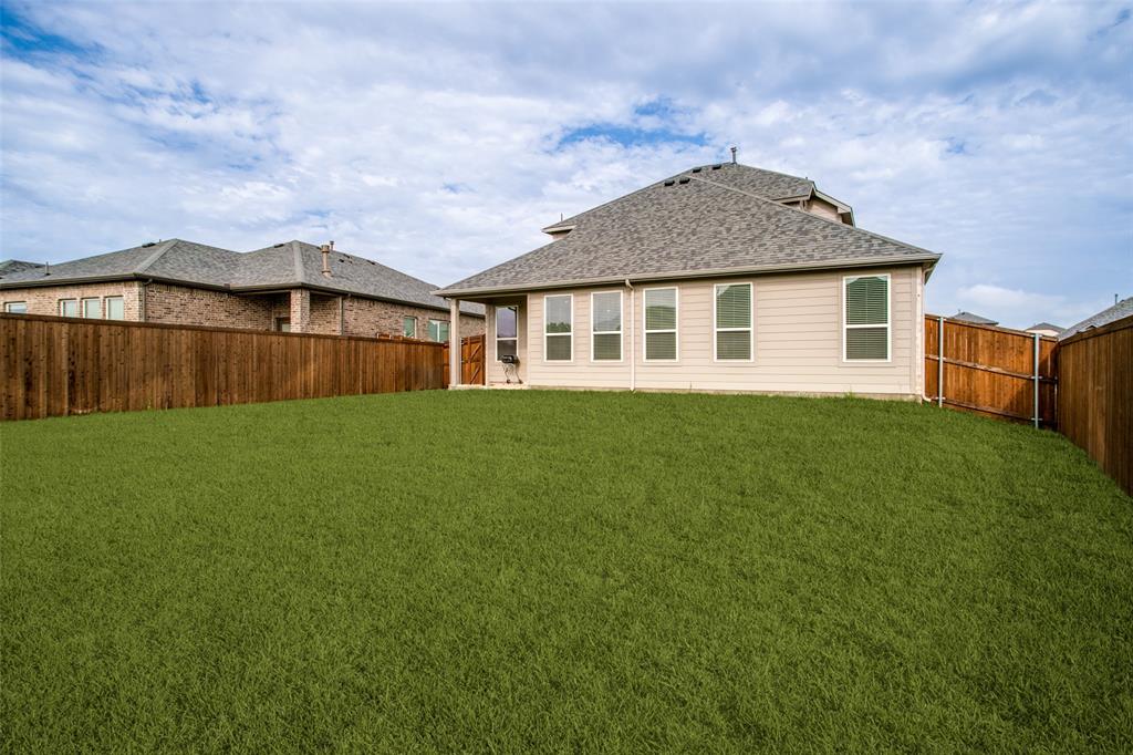 3115 Giovanni Point Princeton, TX 75407 - Photo 24 of 26 Expansive grassy yard with wood fencing