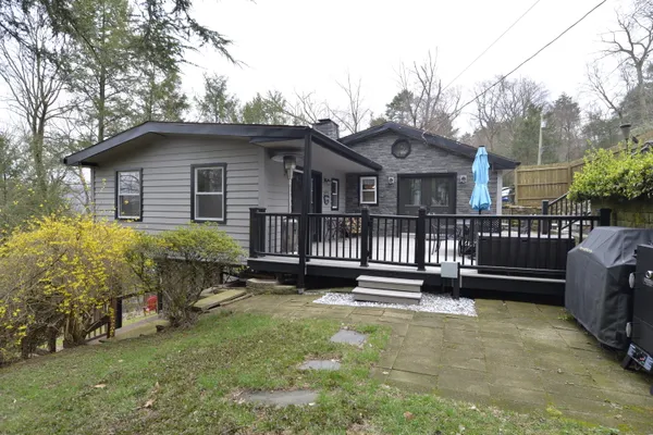 a backyard of a house with a garden and deck