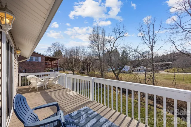 a outdoor space with chairs and wooden floor