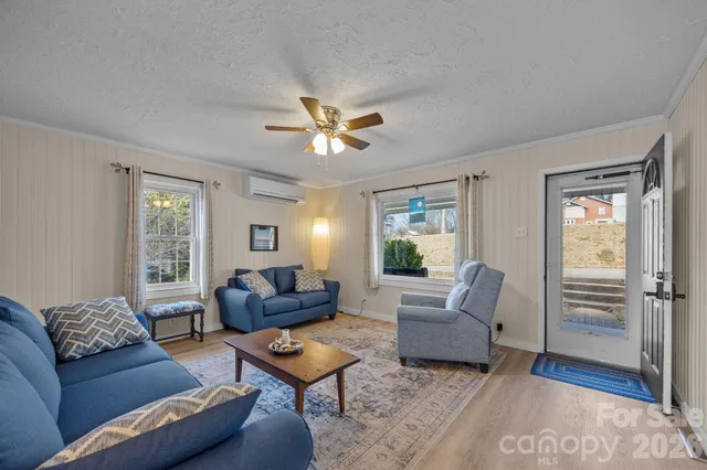 a living room with furniture and a large window