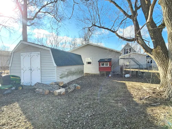 a view of a house with a yard and garage