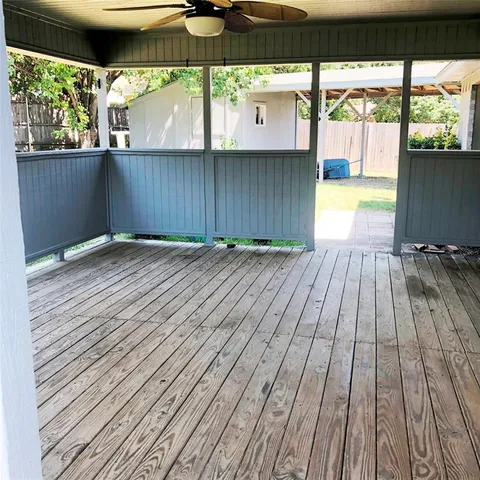 a view of outdoor space with wooden floor