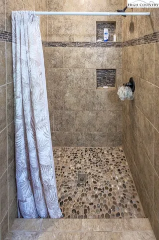 a bathroom with a shower curtain